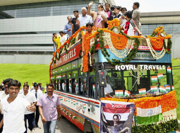 Champion Saina returns home 