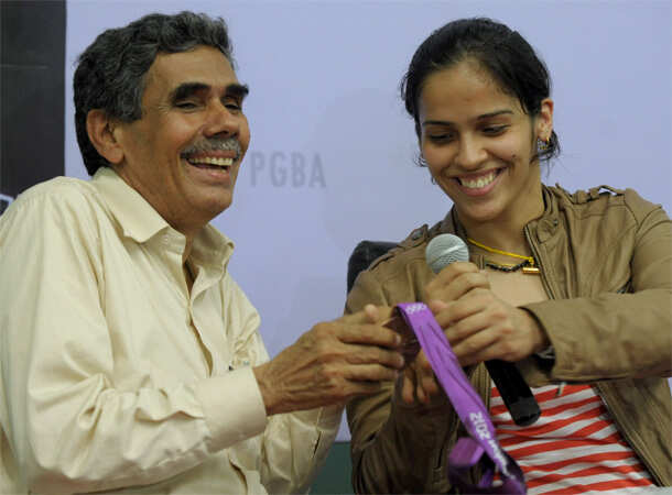 Champion Saina returns home 