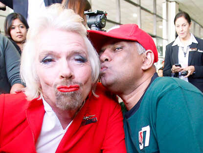 Richard Branson dresses up as AirAsia flight attendant