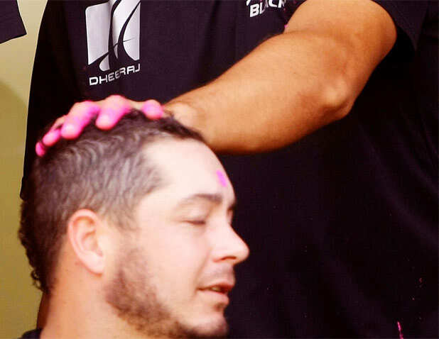New Zealand players celebrate Holi