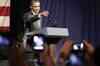 Obama heckled at fundraiser