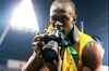 Usain Bolt takes his own pic after historic sprint double
