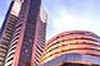 Sensex closes in green, crosses 11,000 mark