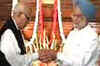 Advani, PM meet in Parliament, shake hands