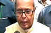 Pranab sets example, travels economy class