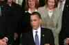 Obama signs healthcare bill into law