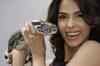 Mallika snuggles up to snake, PETA fumes