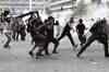 Greece says yes to austerity, clashes in Athens continue