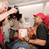 Richard Branson dresses up as AirAsia flight attendant